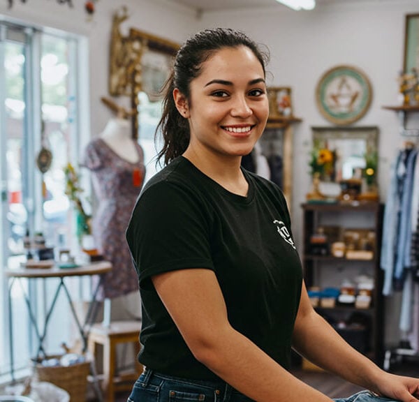 A small business owner in Australia working and considering purchasing another business