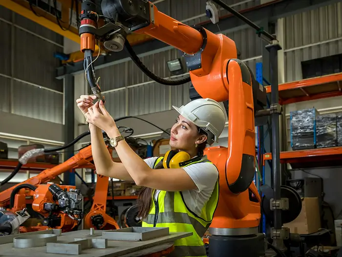 Manufacturing worker operating industrial equipment funded by Sydney business loan